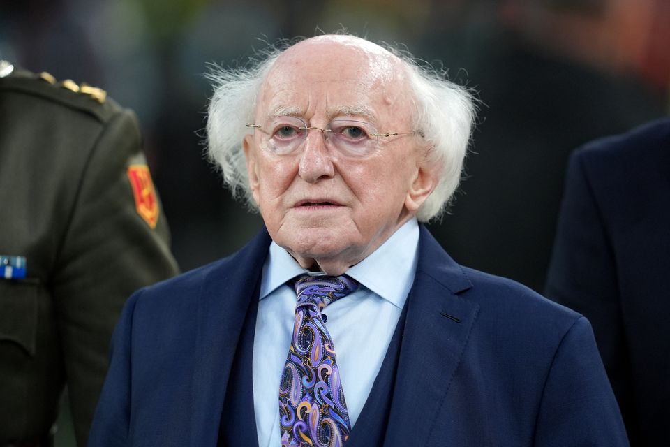 President of Ireland Michael D Higgins lit a candle to remember those who are missing (Niall Carson/PA)