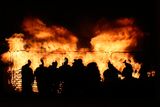 thumbnail: People attend an 11th night Bonfire in the Sandy Row area of Belfast.  Pic: Niall Carson/PA Wire