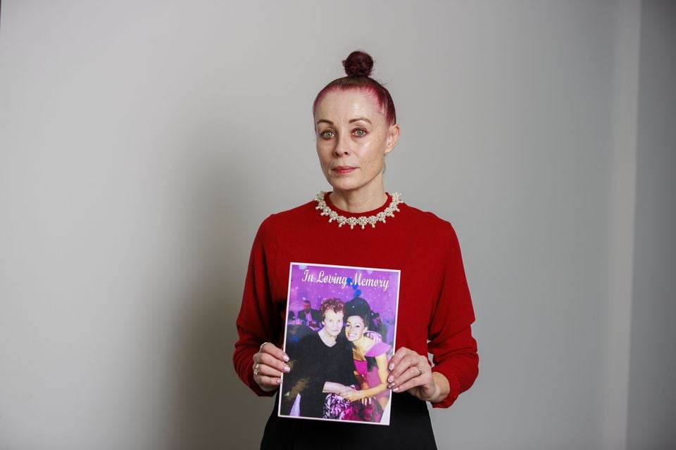 Martina Ferguson holds an image of her late mother Ursula Derry (Liam McBurney/PA)