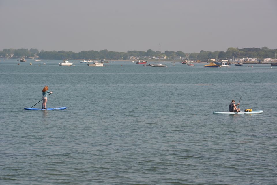 Paddle boarders enjoy calm conditions in Langstone Harbour in Portsmouth, Hampshire (Ben Mitchell/PA)