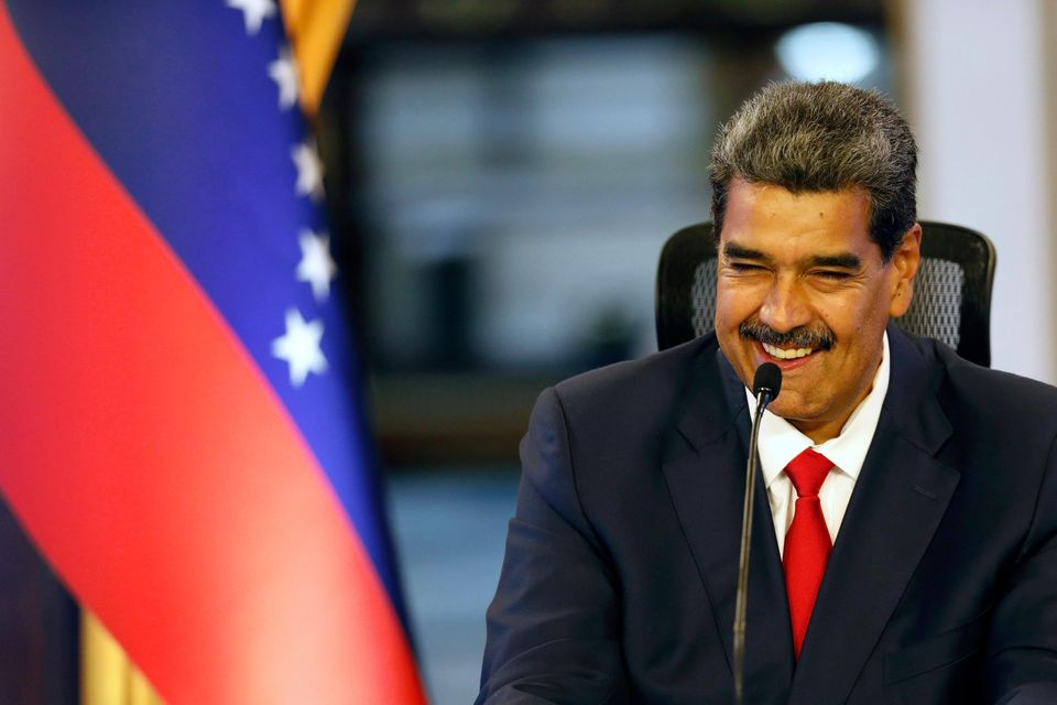 Venezuelan President Nicolas Maduro smiles during a press conference at the Miraflores presidential palace. (AP Photo/Cristian Hernandez)