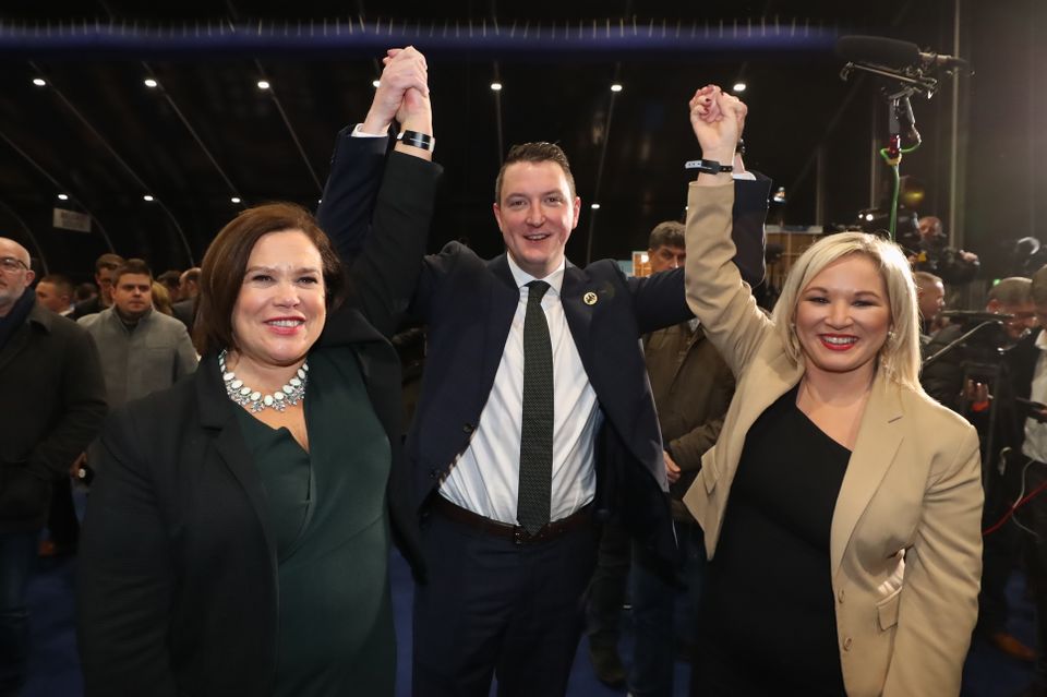 Sinn Fein’s John Finucane celebrates with party leader Mary Lou McDonald, left, and deputy leader Michelle O’Neill after winning in the Belfast North constituency (Liam McBurney/PA)