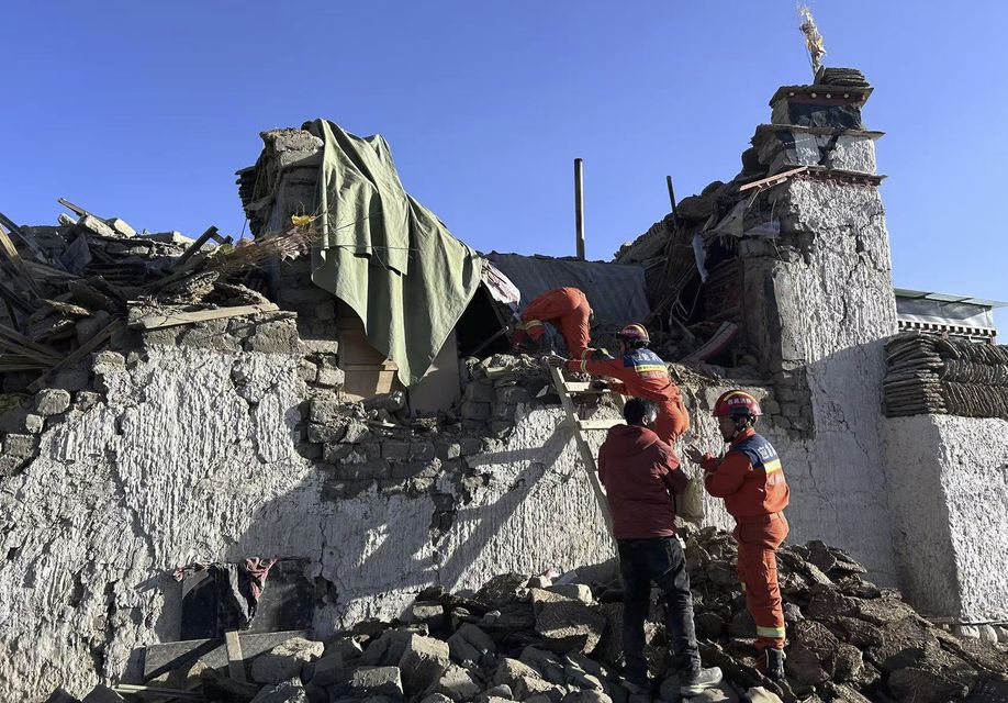 Rescue workers search for survivors in the aftermath of an earthquake in Changsuo Township of Dingri in Xigaze, southwestern China’s Tibet Autonomous Region (Xinhua via AP)