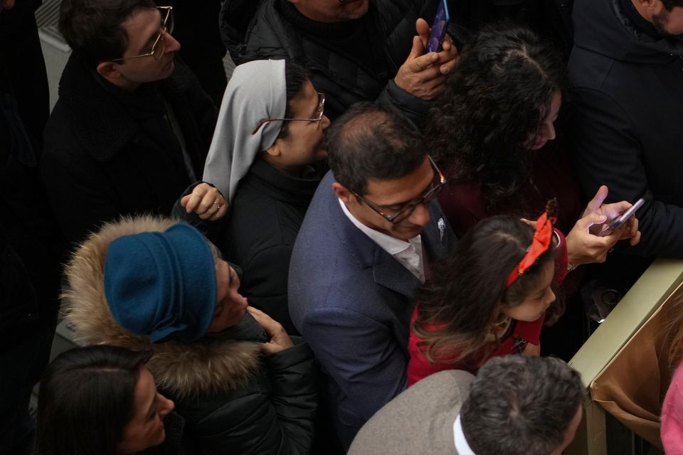 Francis exchanges season greetings with Vatican employees and their families (Andrew Medichini/AP)