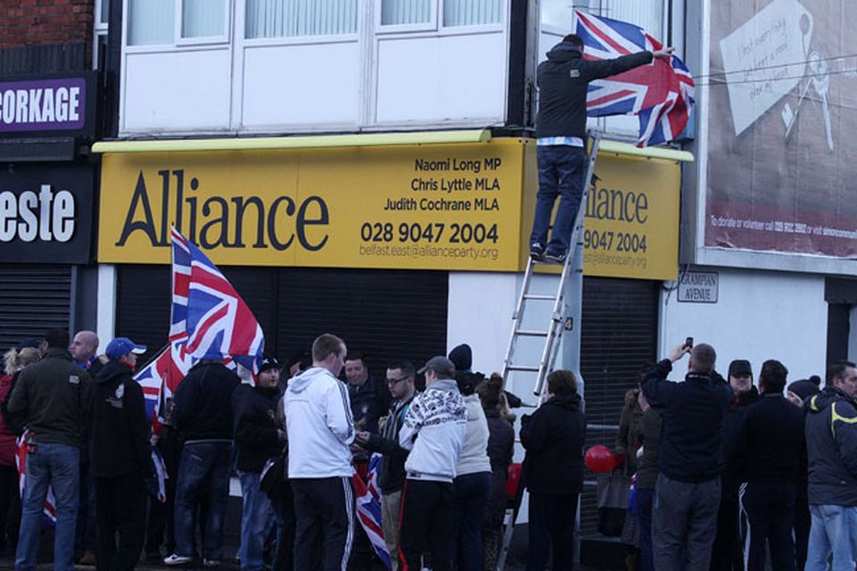 Northern Ireland- 4th December 2012 Mandatory Credit - Photo-Jonathan Porter/Presseye.  Loyalist hold protest at Naomi Long's east Belfast Alliance office following a council vote last night which will see the Union Flag only follow certain days.  Loyalist protesters pictured on the Newtownards Road during the protest.