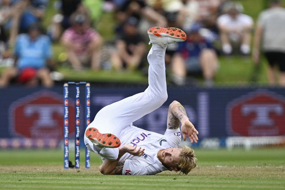 England’s Ben Stokes falls over while bowling (Andrew Cornaga/Photosport/AP)