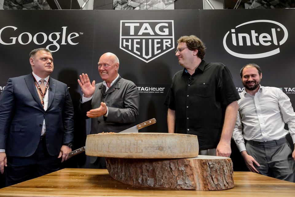 CEO of Tag Heuer, Jean-Claude Biver cuts a wheel of cheese while News  Photo - Getty Images