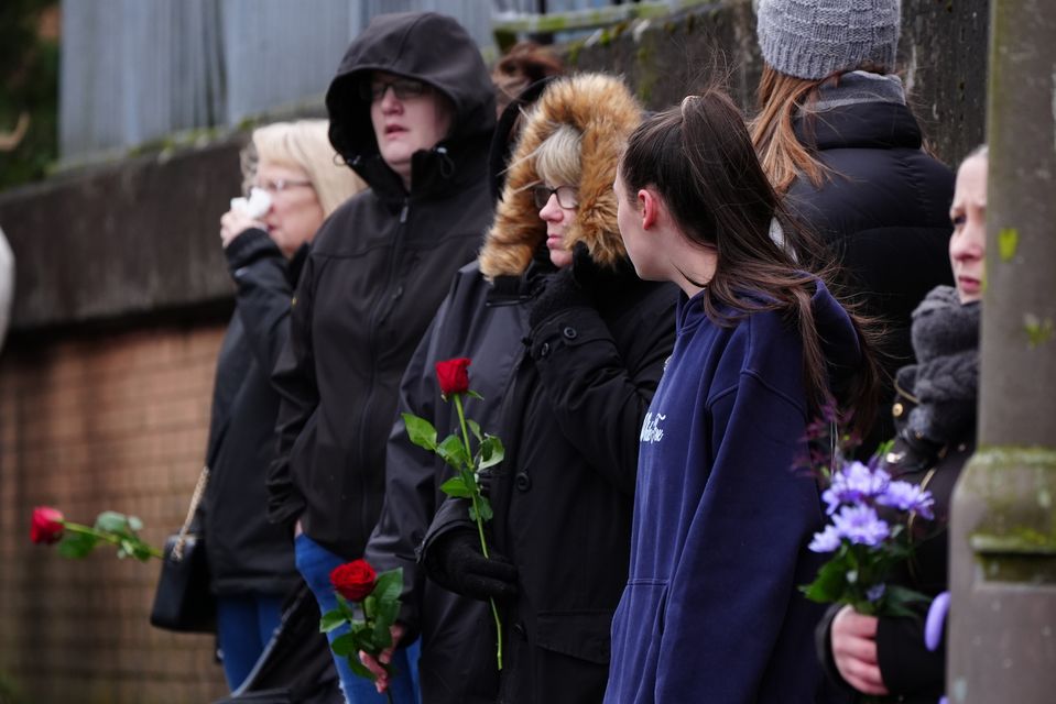 Mourners lined the streets to pay their respects as the hearse went past (Jane Barlow/PA)