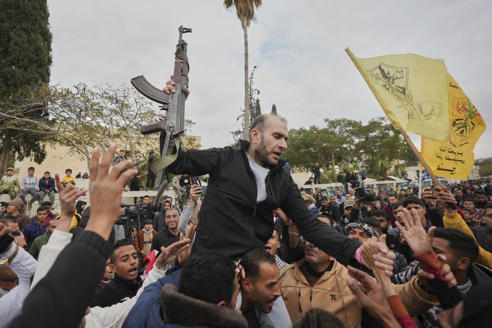 Freed Palestinian prisoner Ammar al-Daghma, 42, is greeted by a crowd as he arrives in the Gaza Strip (Abdel Kareem Hana/AP)