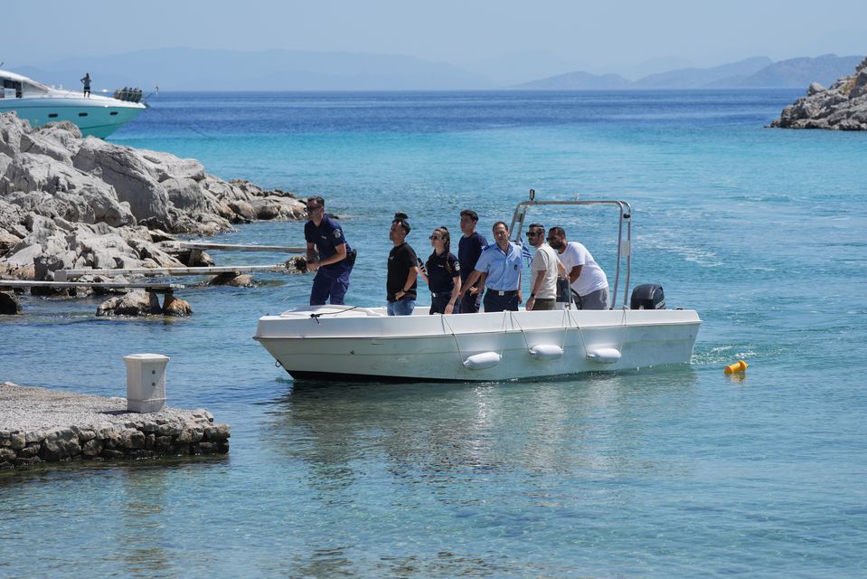 Emergency services on a boat at Agia Marina in Symi, Greece, where Michael Mosley’s body was discovered (Yui Mok/PA)