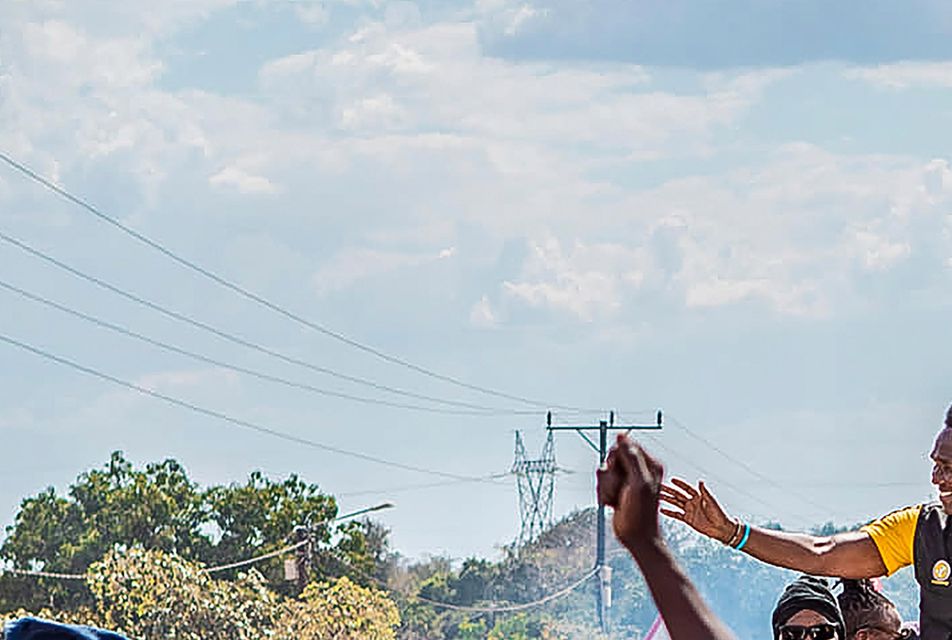 Independent candidate Venacio Mondlane, atop the truck, attends an election rally in Maputo (Carlos Uqueio/AP)