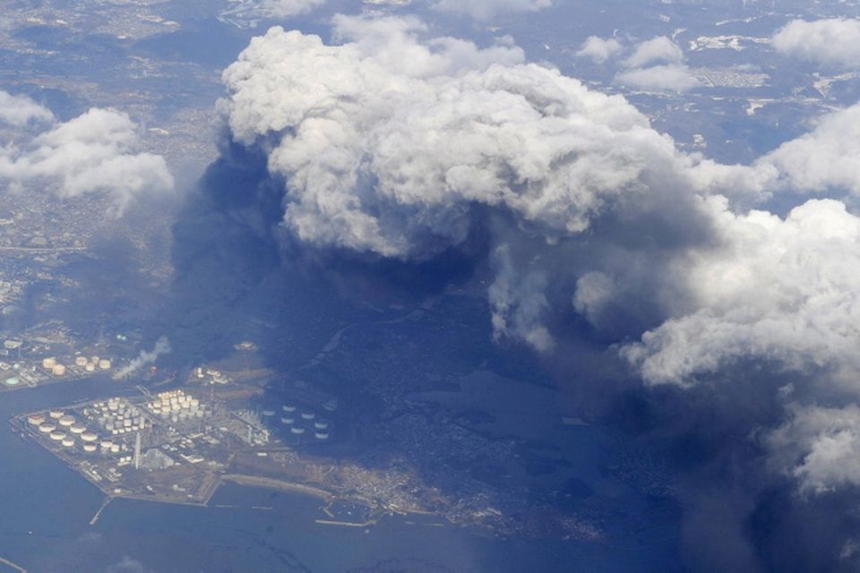 Smoke rises from burning facilities in an industrial zone in Tagajo, Miyagi Prefecture, Saturday morning, March 12, 2011 after Japan's biggest recorded earthquake slammed into its eastern coast Frida