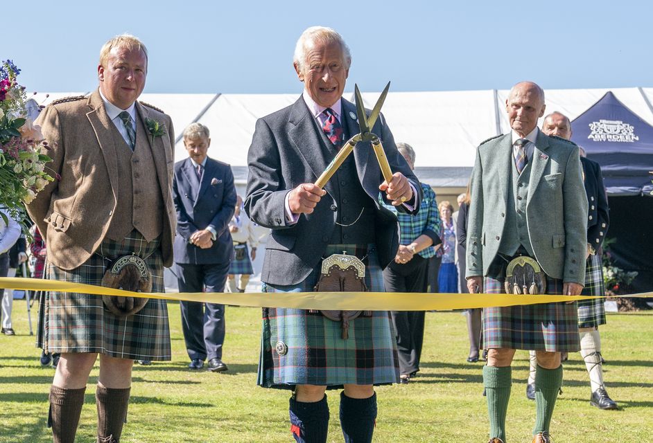 The King uses a pair of gardening shears to officially open the Royal Horticultural Society of Aberdeen’s 200th Flower Show at Duthie Park, Aberdeen (Jane Barlow/PA)