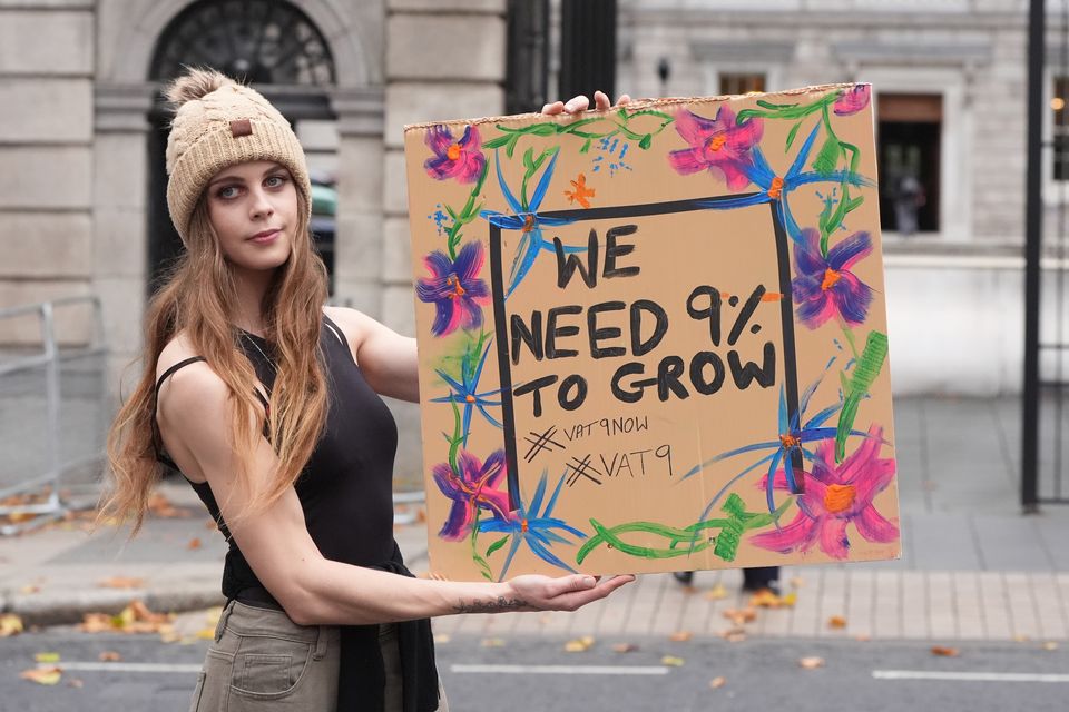 Chef Nicole Whitaker takes part in a protest outside Leinster House, Dublin calling for a reduction in VAT for SMEs  (Niall Carson/PA)