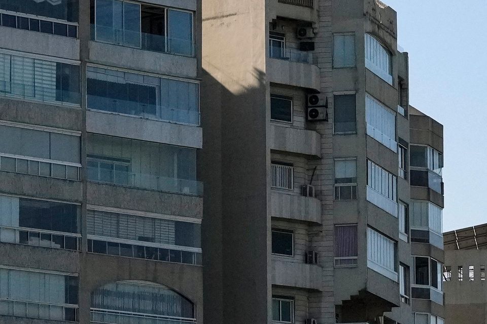 A bomb dropped from an Israeli jet prepares to hit a building in Tayouneh, Beirut (Hassan Ammar/AP)