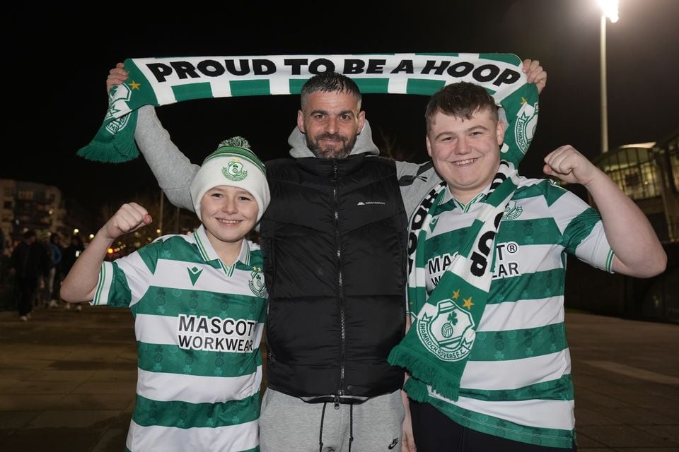 Shamrock Rovers fans Paul Halpin (centre), with his nephews Cillian Halpin, 12, and Ross Halpin, 16 (Brian Lawless/PA)