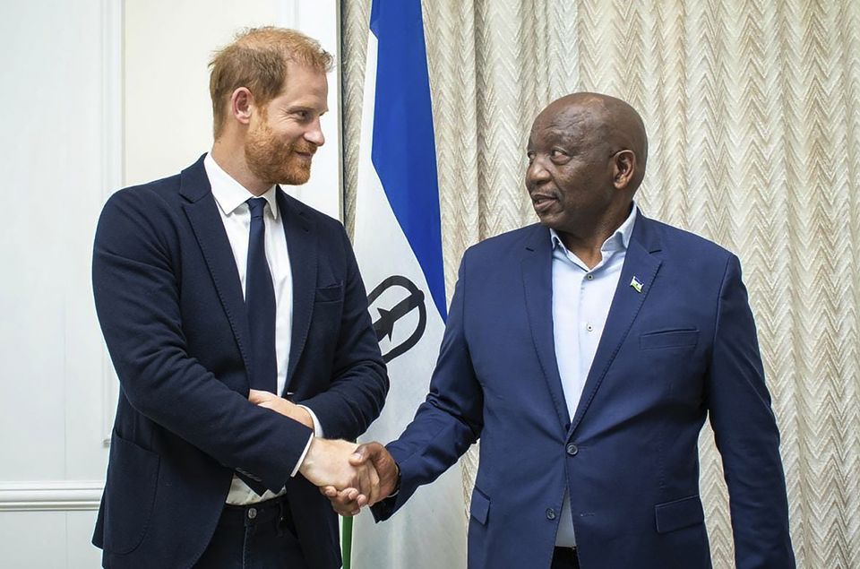 Harry shakes hands with Lesotho’s prime minister Sam Matekane on Wednesday (Lesotho Government/AP)