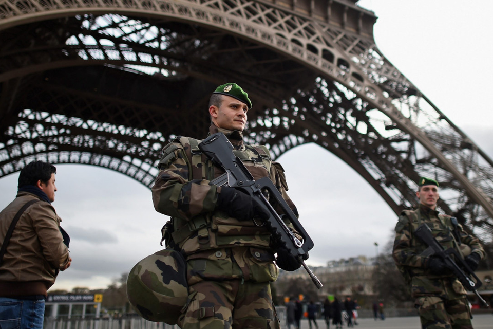French troops patrol around the Eiffel Tower in Paris