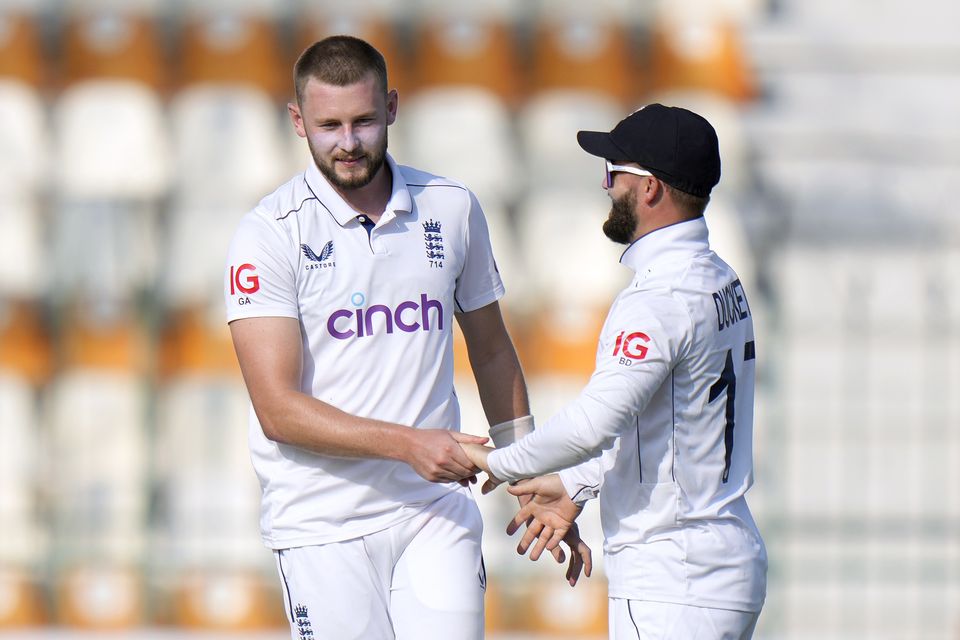 Gus Atkinson, left, was among the wickets for England (Anjum Naveed/AP)