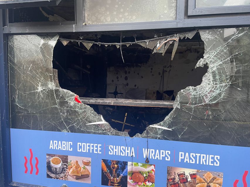 A cafe on the Donegall Road in south Belfast which has been destroyed after it was set alight (Jonathan McCambridge/PA)