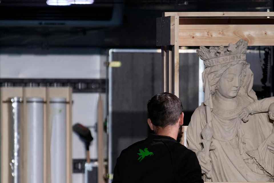 The original Virgin Mary statue, which did not suffer from the 2019 fire, is displayed before returning to Notre Dame Cathedral (Louise Delmotte/AP)