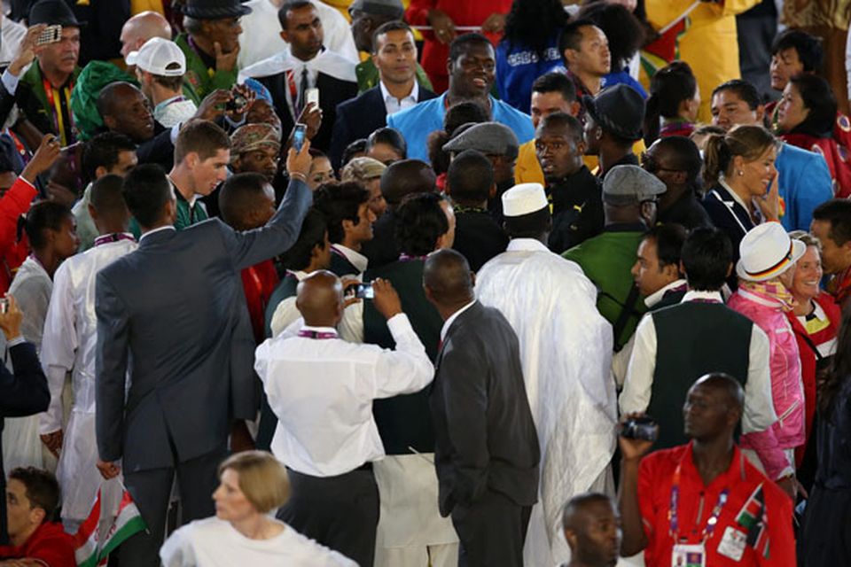 Jamaica's Usain Bolt is mobbed by the other athletes at the Opening Ceremony at the Olympic Stadium, London. PRESS ASSOCIATION Photo. Picture date: Friday July 27, 2012. See PA story OLYMPICS Ceremony. Photo credit should read: Mike Egerton/PA Wire. EDITORIAL USE ONLY