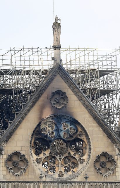 Powerful vacuum cleaners were used to first remove toxic dust released when the fire melted the cathedral’s lead roofs (Gareth Fuller/PA)