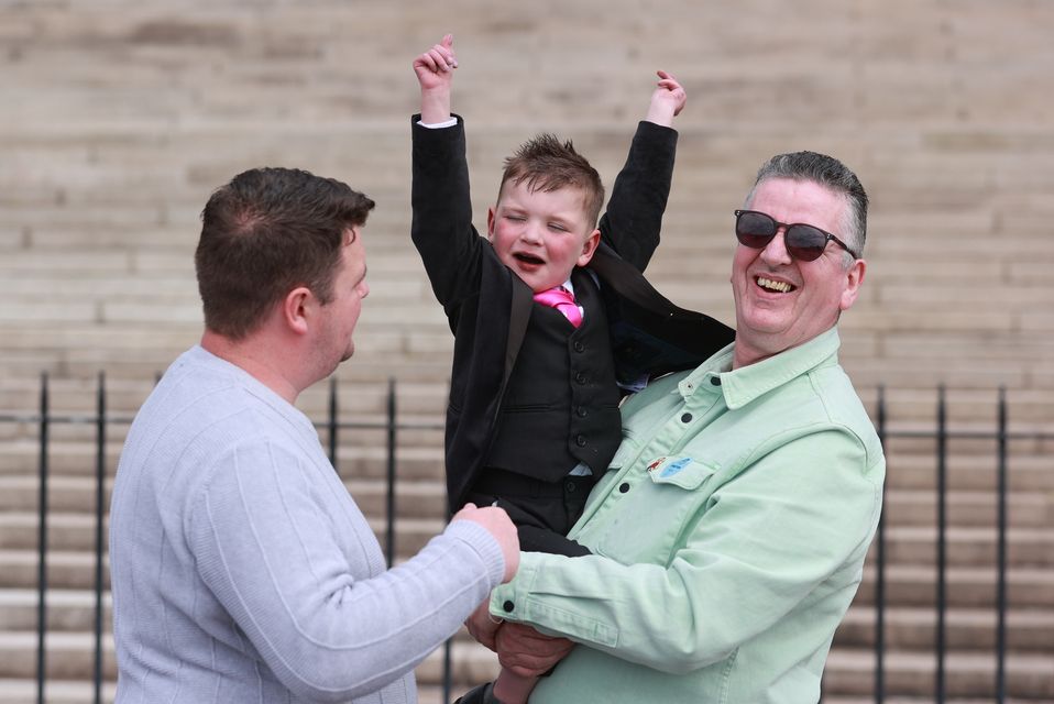 Daithi Mac Gabhann with his father Mairtin outside the Parliament Buildings in Stormont (Liam McBurney/PA)