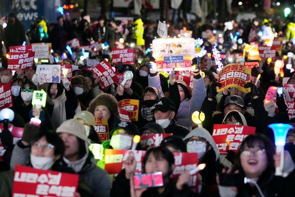 Participants stage a rally to demand South Korean President Yoon Suk Yeol’s impeachment outside the National Assembly in Seoul (AP/Ahnn Young-joon)