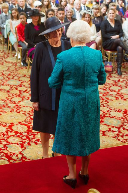 Dame Maggie Smith is made a member of the Order of the Companions of Honour by Queen Elizabeth II during an investiture ceremony at Windsor Castle in 2014 (Dominic Lipinski/PA)