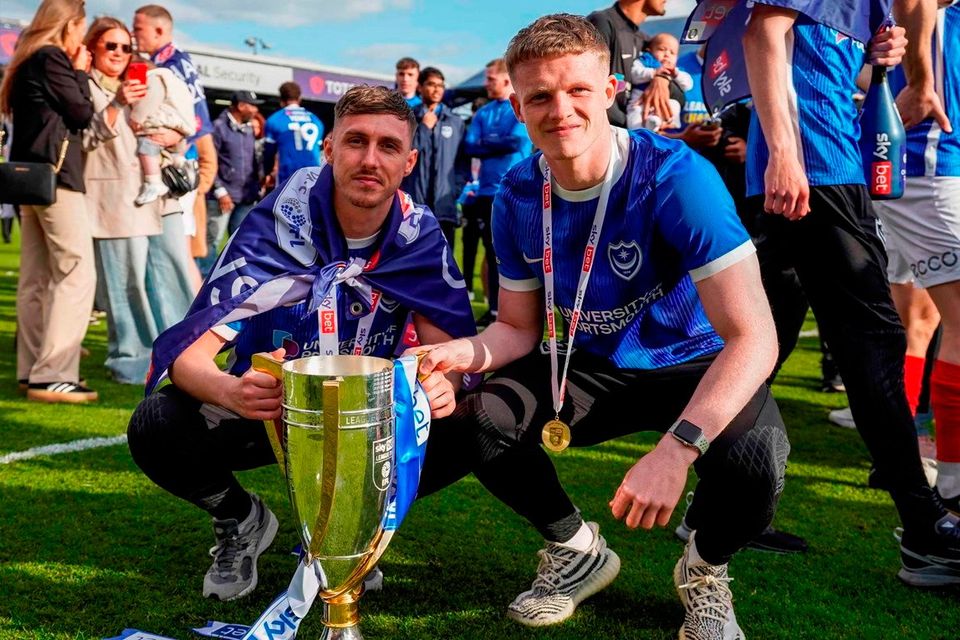Portsmouth pair and former Irish League favourites Gavin Whyte and Terry Devlin with the League One trophy