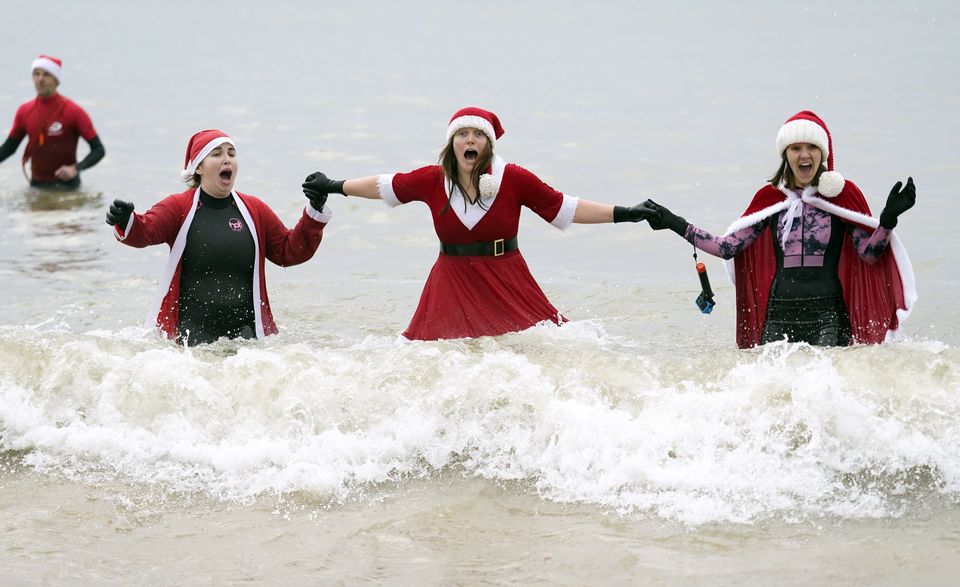 Swimmers at Boscombe Pier in Bournemouth, Dorset (Andrew Matthews/PA)