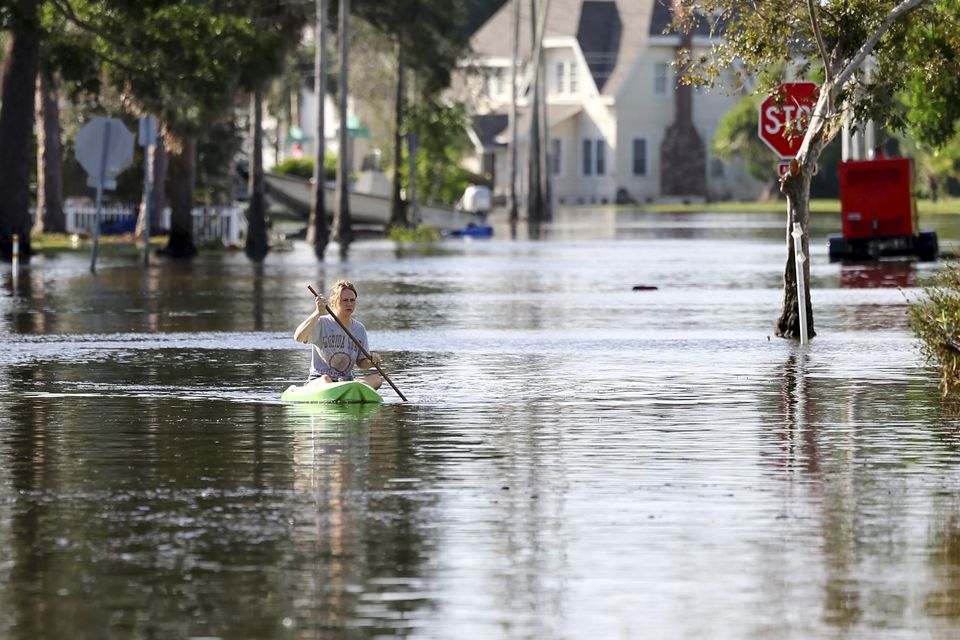 A street flooded by Hurricane Helene (Mike Carlson/AP)