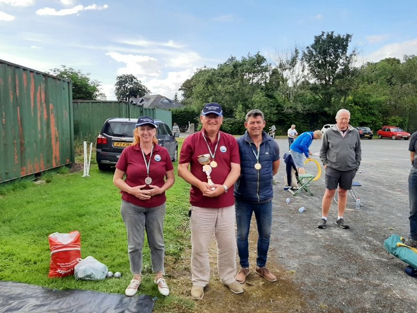 A recent petanque competition in Downpatrick where Dawn came second, with Carl Stuart (centre), chairperson of Ormeau Pétanque Club who came first, and Frank Brétéché, a pétanque player from Downpatrick who came third