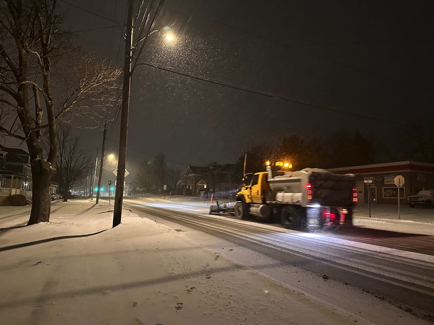 A snowplough passes through Lowville, New York in snowy conditions (Cara Anna/AP)