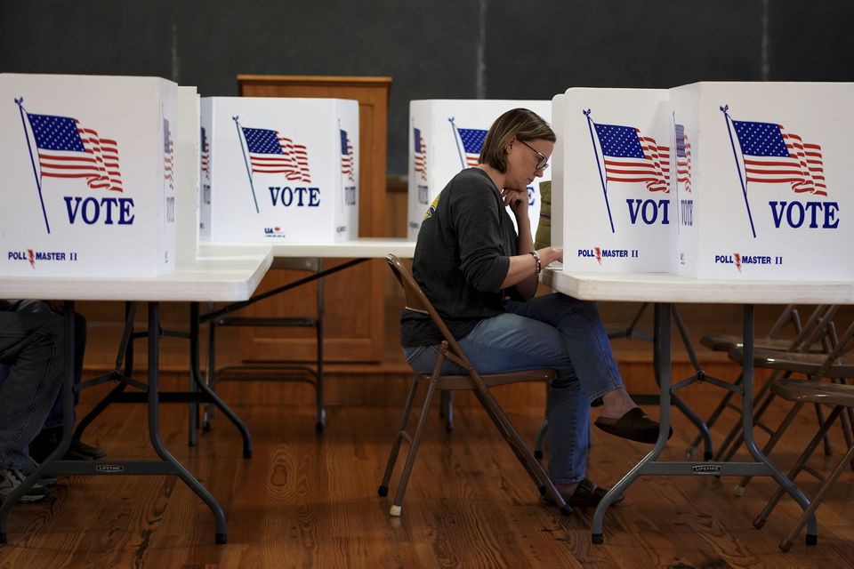 Kristin Scruggs votes at the 146-year-old Buck Creek School on Election Day in rural Perry, Kansas (Charlie Riedel/AP)