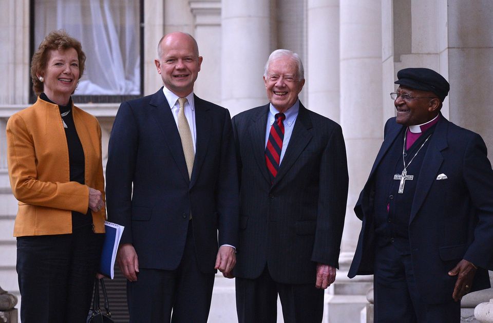 Jimmy Carter with Mary Robinson, Desmond Tutu and then foreign secretary William Hague (Carl Court/PA)