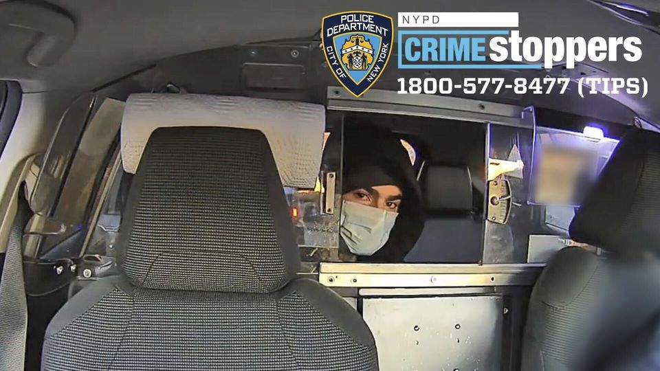 The NYPD issued this photograph, taken from CCTV footage inside a taxi, showing the suspect in the shooting of Brian Thompson (NYPD via AP)