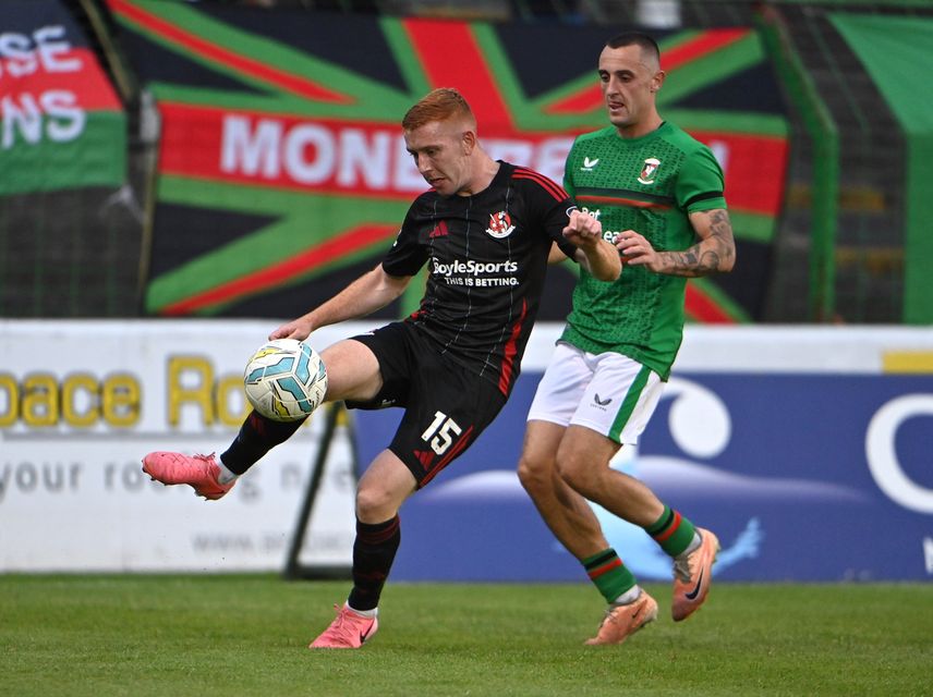 Glentoran's Dylan Connolly with Crusaders Jarlath O’Rourke