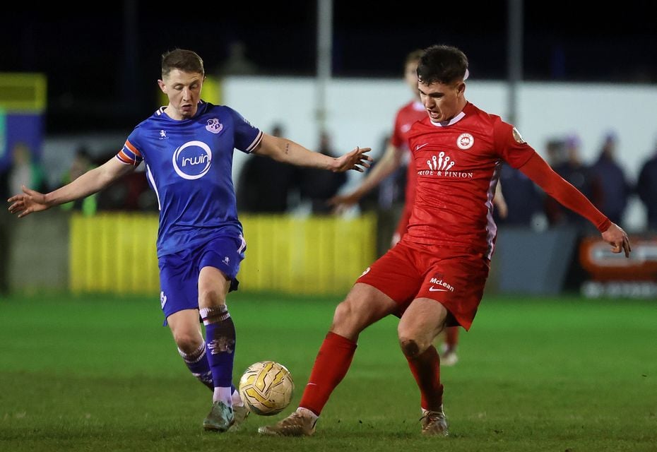 Loughgall's Robbie Norton with Larne's Tiarnan O'Connor