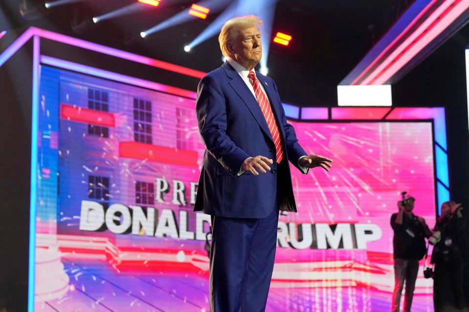 President-elect Donald Trump arrives to speak at AmericaFest in Phoenix, Arizona (Rick Scuteri/AP)