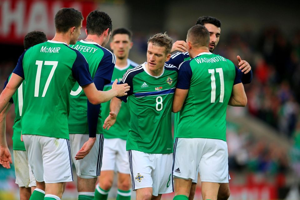 Northern Ireland's Conor Washington (11) celebrates with his team-mates after scoring his side's second goal during the International Friendly at Windsor Park, Belfast. PRESS ASSOCIATION Photo. Picture date: Friday May 27, 2016. See PA story SOCCER N Ireland. Photo credit should read: Niall Carson/PA Wire. RESTRICTIONS: Editorial use only, No commercial use without prior permission, please contact PA Images for further information: Tel: +44 (0) 115 8447447.