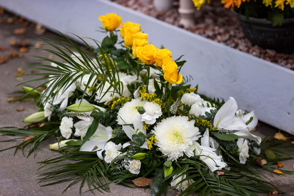 Ten yellow roses in a wreath for each of those who died in the Cresslough tragedy (PA)