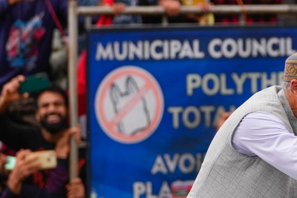 Jammu and Kashmir National Conference (JKNC) party leader Omar Abdullah shakes hands with supporters in Budgam as he celebrates his victory in the election for a local government in Indian-controlled Kashmir (Dar Yasin/AP)