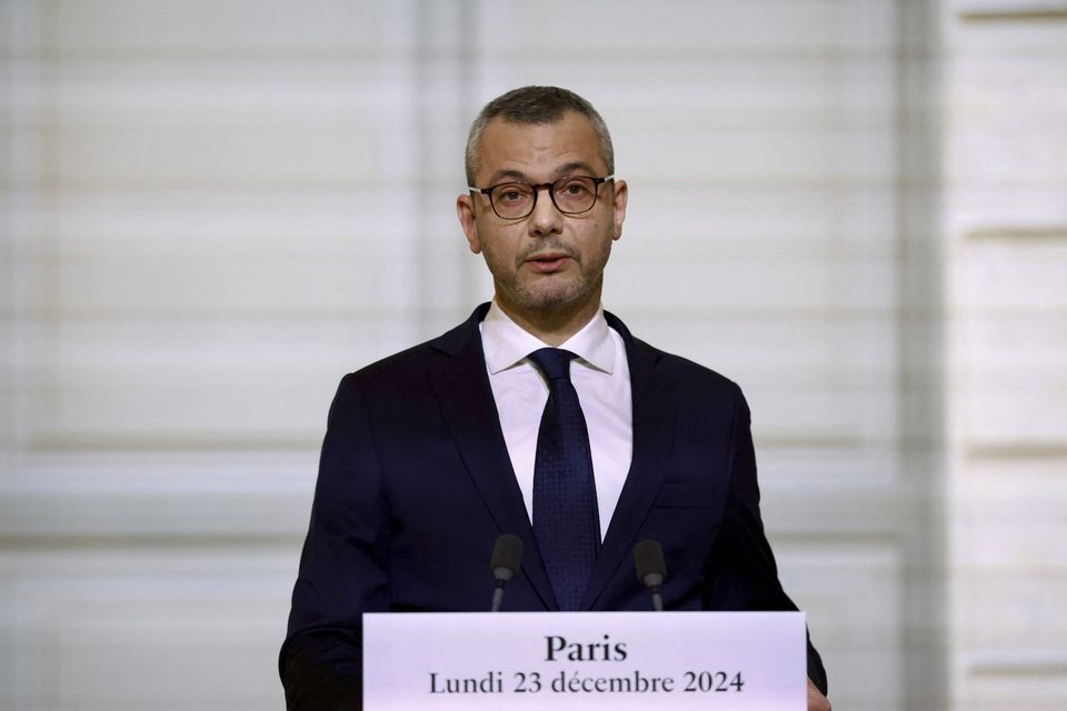 Alexis Kohler, secretary-general of the Elysee Palace, announces the names of the new Cabinet ministers (Saboor Abdul/pool via AP)