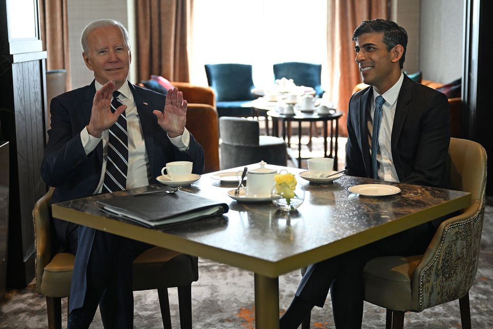 US President Joe Biden (L) reacts as he meets with Prime Minister Rishi Sunak in Belfast
