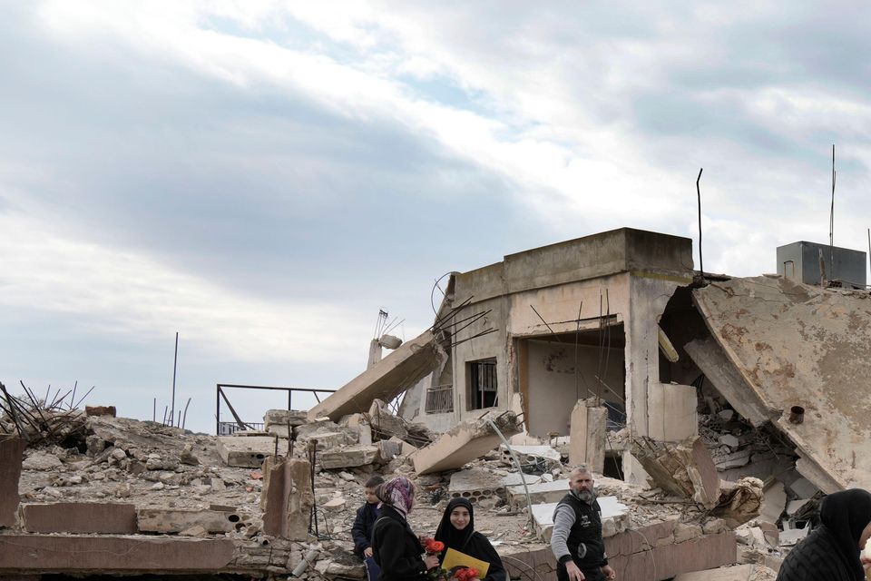 Lebanese citizens check the destruction in the border village of Aita al-Shaab (Bilal Hussein/AP)