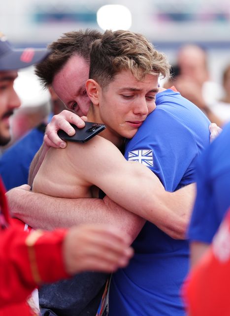 Toby Roberts celebrated by hugging family members (Peter Byrne/PA)