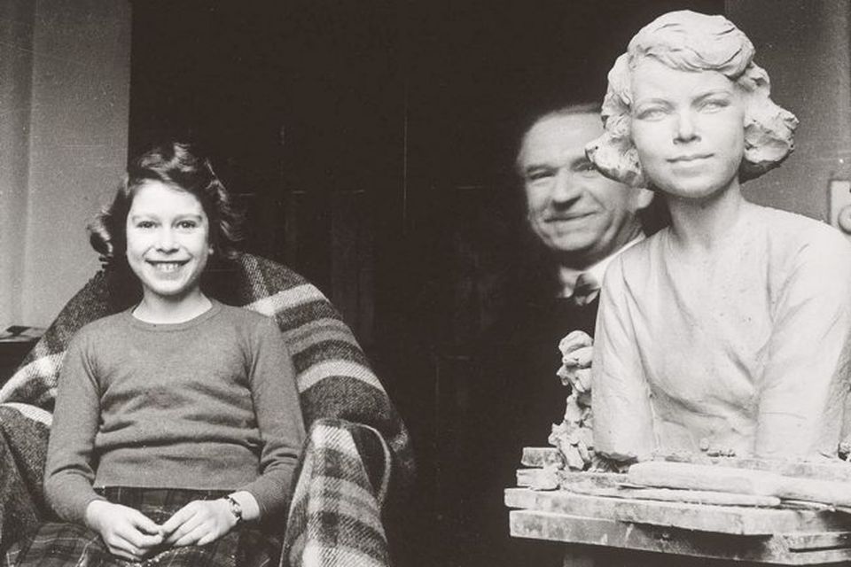 Picture dated 1935 showing Princess Elizabeth sitting in the studio of Hungarian sculptor Sigismund de Strobl (background).
