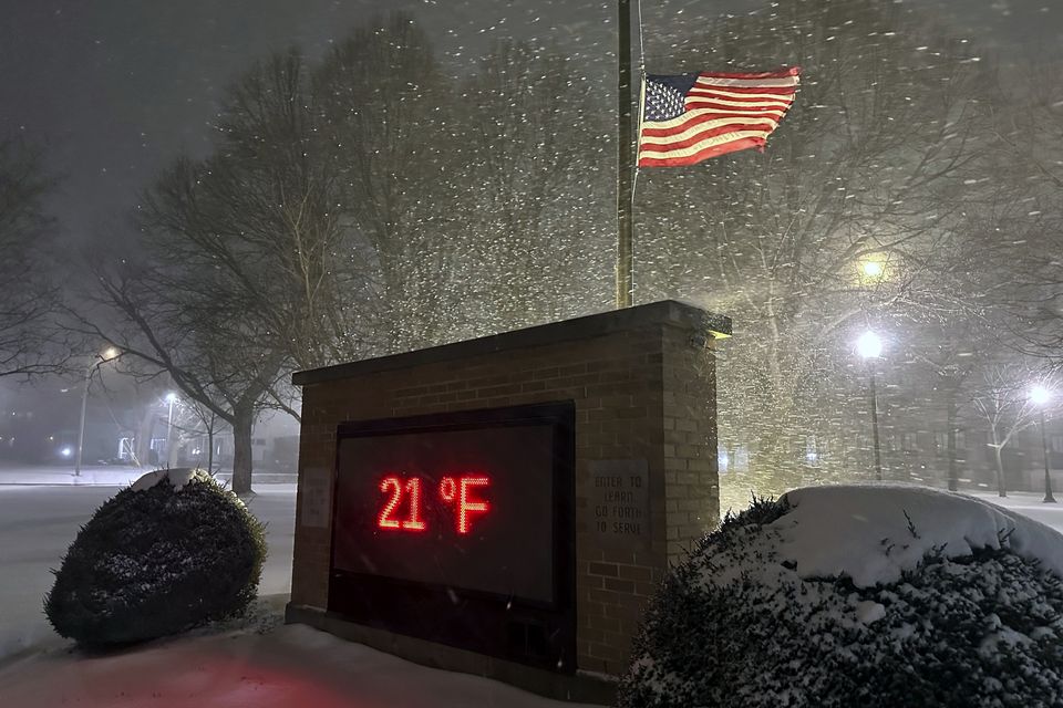 A temperature of 21F (minus 6C) is shown in snowy conditions in Lowville, New York (Cara Anna/AP)